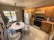 The kitchen features ample cabinet space, a dining area, and natural light from a large window at 2348 Sun Valley Cir, Winter Park, FL 32792