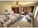 This main bedroom features tile floors, a ceiling fan, and a sitting area at 2348 Sun Valley Cir, Winter Park, FL 32792