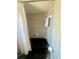 Retro bathroom featuring black tub and patterned wallpaper at 240 Slade Dr, Longwood, FL 32750