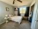 This bedroom features a ceiling fan, window with natural light, and closet space at 240 Slade Dr, Longwood, FL 32750