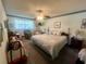 Spacious bedroom featuring a ceiling fan and floral bedding at 240 Slade Dr, Longwood, FL 32750
