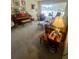 Cozy living room featuring a piano, sofa, and natural light from a large window at 240 Slade Dr, Longwood, FL 32750