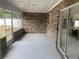 Screened-in patio with access to kitchen and backyard, perfect for entertaining at 2435 W Park Dr., Deland, FL 32724
