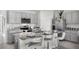 Modern kitchen featuring granite countertops, stainless steel appliances, and a convenient breakfast bar with stool seating at 2604 Grandbury Grove Rd, Lakeland, FL 33811