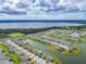 Stunning aerial view of a lakefront community featuring homes with access to canals and a large lake at 2741 Nottel Dr, St Cloud, FL 34772