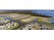 Aerial view of a planned community with water features and lush landscaping at 2741 Nottel Dr, St Cloud, FL 34772