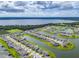 Aerial view of a beautiful, well-planned neighborhood with water access, lush landscaping and sidewalks at 2741 Nottel Dr, St Cloud, FL 34772
