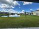 A view of a backyard and a pond at 2741 Nottel Dr, St Cloud, FL 34772