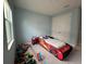 bedroom with a race car bed and blue walls, perfect for a space at 2741 Nottel Dr, St Cloud, FL 34772