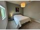 Bedroom featuring a comfortable bed, soft lighting and neutral décor at 2741 Nottel Dr, St Cloud, FL 34772