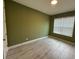 Bedroom featuring wood-look tile flooring and a sunny window at 2741 Nottel Dr, St Cloud, FL 34772