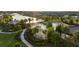 Community pool and recreational area with lounge chairs, play area, and lush tropical landscaping at 2741 Nottel Dr, St Cloud, FL 34772