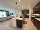 Open floor plan featuring a kitchen with an island and stainless steel appliances at 2741 Nottel Dr, St Cloud, FL 34772