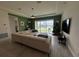 Inviting living room featuring a large sectional sofa, a water view and a Christmas tree at 2741 Nottel Dr, St Cloud, FL 34772