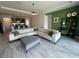 Open-concept living room flowing into a modern kitchen with bar seating at 2741 Nottel Dr, St Cloud, FL 34772