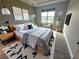Stylish main bedroom features modern decor, natural light, and sleek furnishings at 2741 Nottel Dr, St Cloud, FL 34772