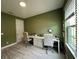 Bright office space with a large desk, multiple chairs, and ample natural light at 2741 Nottel Dr, St Cloud, FL 34772