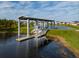 Waterfront community covered dock and boat slip with stairs and ramp access at 2741 Nottel Dr, St Cloud, FL 34772