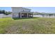 Expansive backyard features a well-maintained lawn, offering ample space for outdoor activities and relaxation at 2965 Slough Creek Dr, Kissimmee, FL 34744