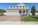 Charming two-story home with a brick driveway, two-car garage and manicured landscaping at 2965 Slough Creek Dr, Kissimmee, FL 34744
