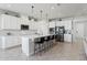 Spacious modern kitchen with white cabinets, stainless steel appliances, and large center island at 2965 Slough Creek Dr, Kissimmee, FL 34744