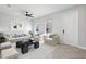 Bright living room with tile floors, neutral furniture, and modern decor, and ceiling fan at 2965 Slough Creek Dr, Kissimmee, FL 34744