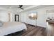 Spacious main bedroom with hardwood floors, white furniture, and an en-suite bathroom at 2965 Slough Creek Dr, Kissimmee, FL 34744
