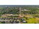 Aerial view of the property and neighborhood, showcasing proximity to lush greenery and nearby amenities at 305 Kays Landing Dr, Sanford, FL 32771
