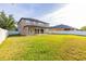 Backyard with an expansive lawn and a white vinyl fence at 305 Kays Landing Dr, Sanford, FL 32771