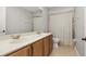 Traditional bathroom features a double sink vanity and a shower-tub combo at 305 Kays Landing Dr, Sanford, FL 32771