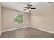 This bright bedroom features a ceiling fan and hardwood floors, capturing cozy comfort at 305 Kays Landing Dr, Sanford, FL 32771