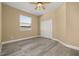 Bedroom showcasing neutral walls, ceiling fan, and light gray wood-look floors at 305 Kays Landing Dr, Sanford, FL 32771