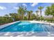 A refreshing community pool is surrounded by lush greenery, providing a relaxing oasis for residents at 305 Kays Landing Dr, Sanford, FL 32771