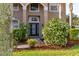Elegant front entrance featuring manicured landscaping and a decorative glass door at 305 Kays Landing Dr, Sanford, FL 32771