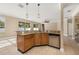 Gourmet kitchen bar area showcases granite countertops, pendant lighting, and stainless steel appliances at 305 Kays Landing Dr, Sanford, FL 32771