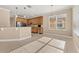 Well-lit kitchen with stainless steel appliances, breakfast bar, granite countertops and pendant lighting at 305 Kays Landing Dr, Sanford, FL 32771