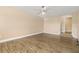 Bright, open living room featuring wood-look floors and a ceiling fan at 305 Kays Landing Dr, Sanford, FL 32771