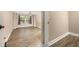 Spacious living room with wood-look floors and modern lighting at 305 Kays Landing Dr, Sanford, FL 32771