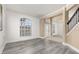 Bright living room with gray wood-look flooring and detailed molding at 305 Kays Landing Dr, Sanford, FL 32771