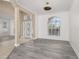 Inviting living room with gray wood-look flooring and detailed molding at 305 Kays Landing Dr, Sanford, FL 32771
