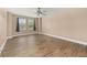 Bright living room with wood-look floors and modern lighting at 305 Kays Landing Dr, Sanford, FL 32771
