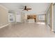 Open-concept living area featuring tile floors, modern ceiling fan, and seamless flow to kitchen at 305 Kays Landing Dr, Sanford, FL 32771