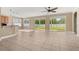 Open living room featuring tile flooring and large sliding glass doors to the backyard at 305 Kays Landing Dr, Sanford, FL 32771