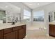 Bright main bathroom showcasing a soaking tub, large vanity, and great natural light at 305 Kays Landing Dr, Sanford, FL 32771