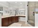 Luxurious main bathroom with double vanity, glass enclosed shower and natural light at 305 Kays Landing Dr, Sanford, FL 32771