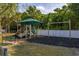 Community playground featuring a play structure with slides, swings, and a covered area at 305 Kays Landing Dr, Sanford, FL 32771
