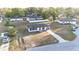 Aerial view of a charming single-Gathering home with a driveway and landscaped front yard at 312 Oak Track Ter, Ocala, FL 34472