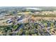 Aerial view featuring a home near a school and recreational fields at 312 Oak Track Ter, Ocala, FL 34472