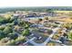 Aerial view of a quiet neighborhood with a school in the background at 312 Oak Track Ter, Ocala, FL 34472