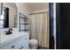 Updated bathroom with a modern vanity, sleek fixtures, and a stylish shower curtain at 312 Oak Track Ter, Ocala, FL 34472